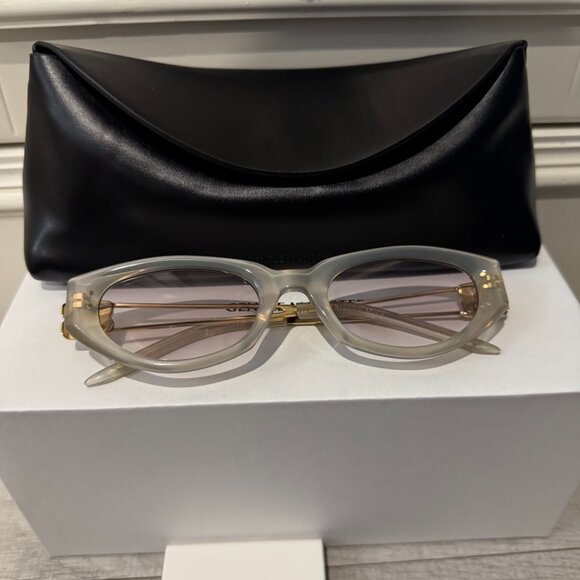 Gentle Monster Translucent Oval Sunglasses Gold Metal Detail